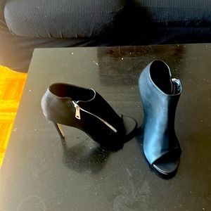 Black booty boot with side zipper Red heels with red satan ribbon.